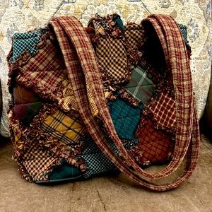 Medium size purse, with multicolor plaid designs! Inside has many pockets!